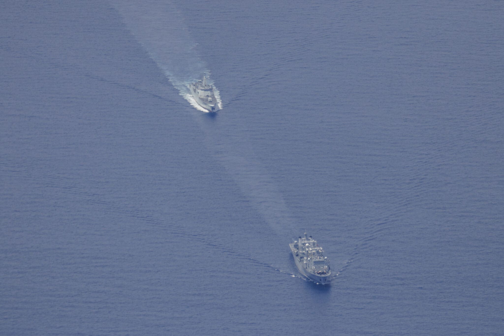 From left - Peoples Liberation Army-Navy Renhai-class cruiser Zunyi, and Fuchi-class replenishment vessel Weishanhu. *** Local Caption *** As part of Australias whole-of-government maritime border protection efforts, Defence routinely monitors all maritime traffic in our Exclusive Economic Zone and maritime approaches. Australia respects the right of all states under international law to exercise freedom of navigation and overflight in international waters and airspace, just as we expect others to respect our right to do the same.