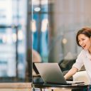 Beautiful Asian girl celebrate with laptop, success happy pose. E-commerce, university education, internet technology, or startup small business concept. Modern office or living room with copy space